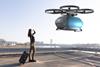 Flying,Transportation,Drone,Picking,Up,A,Passenger