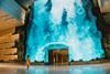 Be transported to a captivating realm as a grand digital waterfall descends at T2's departure hall