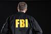 Mature,Fbi,Agent,On,Black,Background,,Back,View