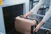 Security,Checkpoint,In,Airport,Terminal:,Passenger,Places,Suitcase,On,Conveyor