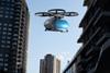 Transportation,Drone,Flying,Next,To,Buildings