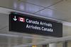 Airport,Sign,Indicating,Canada,Arrivals,In,English,And,French,With