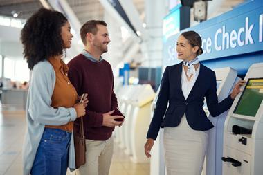 Woman, passenger assistant and couple at airport by self service check in station for information, help or FAQ. Portrait of happy female services agent helping travelers register or book air flight
