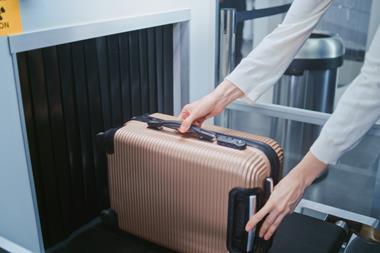 Security,Checkpoint,In,Airport,Terminal:,Passenger,Places,Suitcase,On,Conveyor