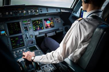 Pilot's,Hand,Accelerating,On,The,Throttle,In,A,Commercial,Airliner