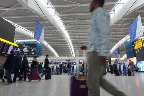 Air,Travellers,Check,Into,Flights,At,Heathrow,Airport's,Departure,Hall