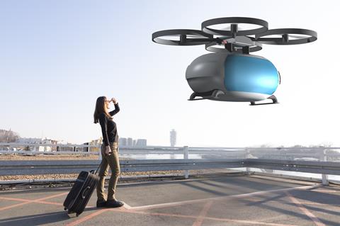 Flying,Transportation,Drone,Picking,Up,A,Passenger