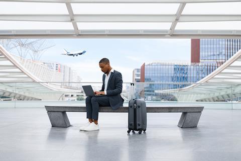 African,American,Businessman,Working,On,Laptop,While,Waiting,Flight,At