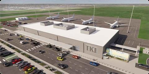 airport-terminal-with-sleek-architecture-and-large-glass-windows-bustling-with-travelers-and-surrounded-by-green-landscaping