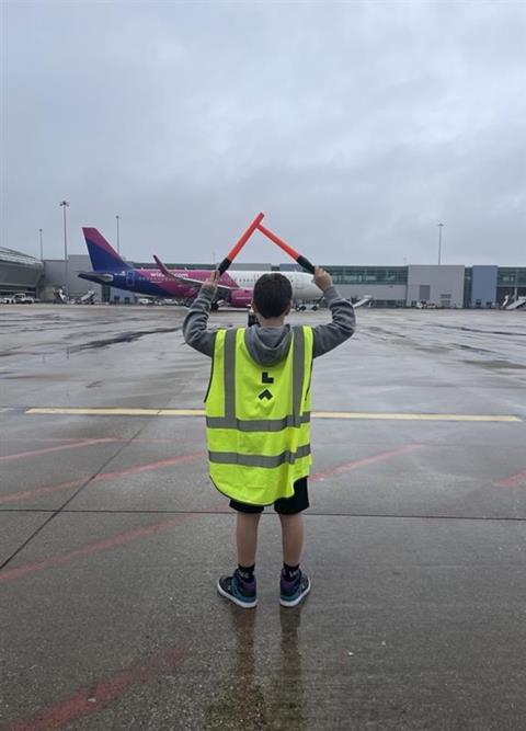 Seth Drinkell learning how to marshall an aircraft