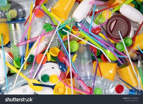 stock-photo-disposable-single-use-plastic-objects-such-as-bottles-cups-forks-spoons-and-drinking-straws-that-1655336893