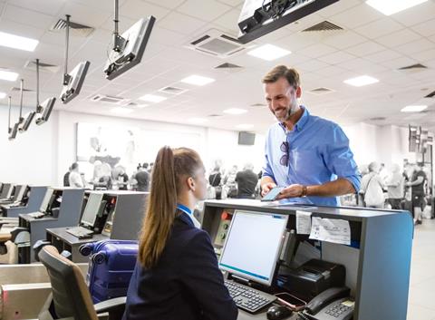Passenger doing check-in for flight at airport