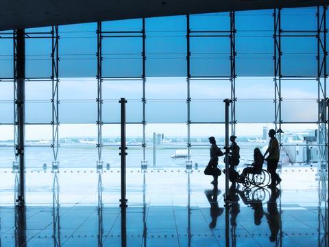 Passengers,And,Disabled,Person,In,The,Interior,Of,The,Airport
