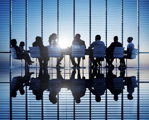 Silhouettes,Of,Business,People,In,A,Conference,Room.