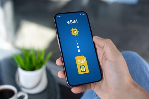 Man,Hand,Hold,Phone,With,Sim,Card,Replacement,On,Esim