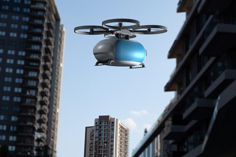 Transportation,Drone,Flying,Next,To,Buildings
