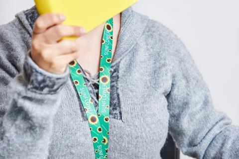 Unrecognizable,Woman,Reading,A,Yellow,Book,,Studying,At,Home,,Using