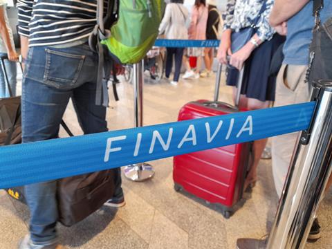 Passengers,Wait,At,The,Check-in,Counter,To,Be,Processed,At