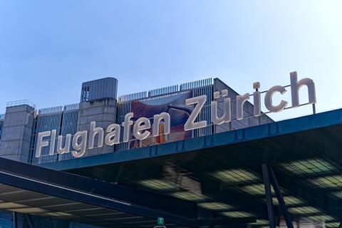 White,Lettering,At,Entrance,Of,Swiss,Airport,Zürich,Kloten,On