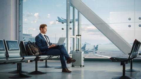 Modern,Airport,Terminal:,Handsome,Businessman,Working,On,Laptop,Computer,While