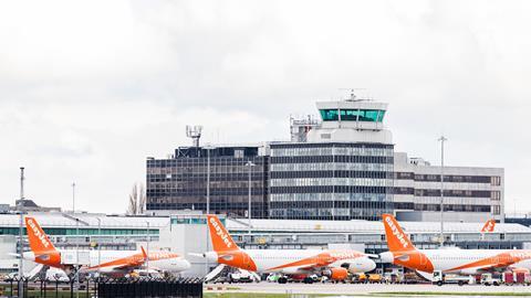 Three,Easyjet,Airbus,A320-214,Aircraft,Pictured,In,A,Terminal,Under