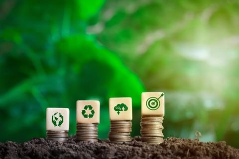 Coins,And,Wooden,Blocks,With,Symbols,About,Loving,The,Earth