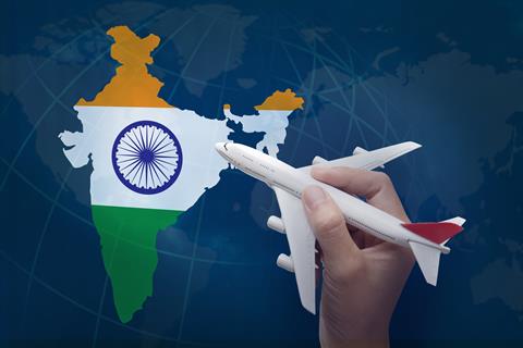 Hand,Holding,Airplane,With,Map,Of,India.