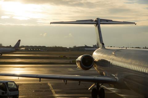 Parked,Airplanes:,Large,Commercial,Plane,Is,Parked,By,The,Airport