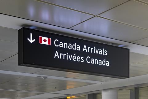 Airport,Sign,Indicating,Canada,Arrivals,In,English,And,French,With